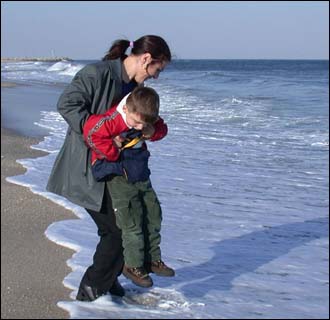Rinor Peci and his mother Myzafere from Kosovo in former Yugoslavia. His first big water, the Atlantic Ocean, New Jersey, February 16 2002